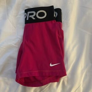 Hot pink Nike Pros